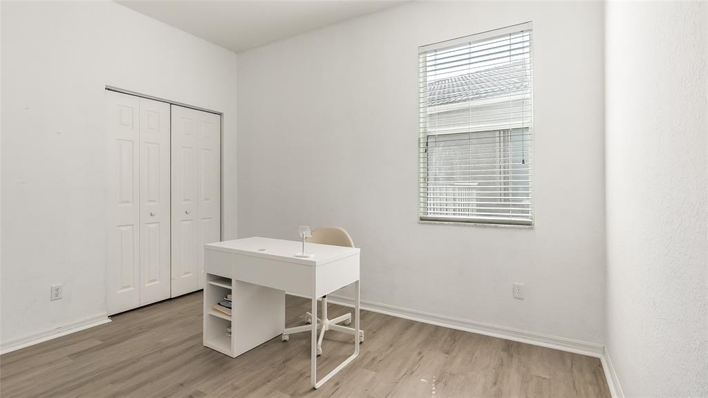 19470 Stonebrook Street Weston, FL 33332 - Photo 39 of 44 a work room with a table and windows