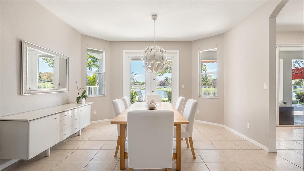 19470 Stonebrook Street Weston, FL 33332 - Photo 6 of 44 a dining room with furniture and window