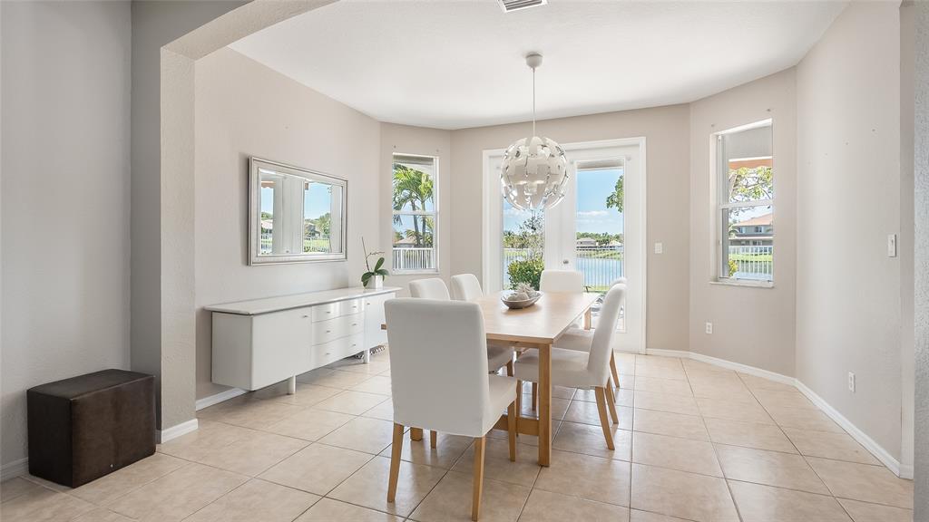 19470 Stonebrook Street Weston, FL 33332 - Photo 7 of 44 a dining room with furniture and window