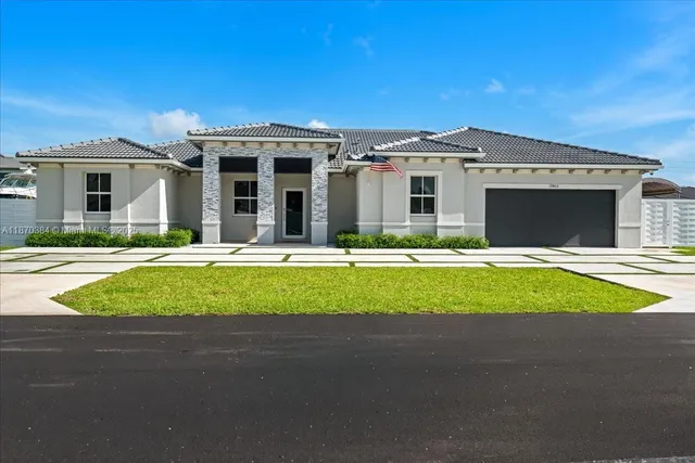 a view of house with outdoor space and balcony