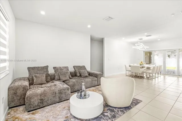 a living room with furniture and a couch