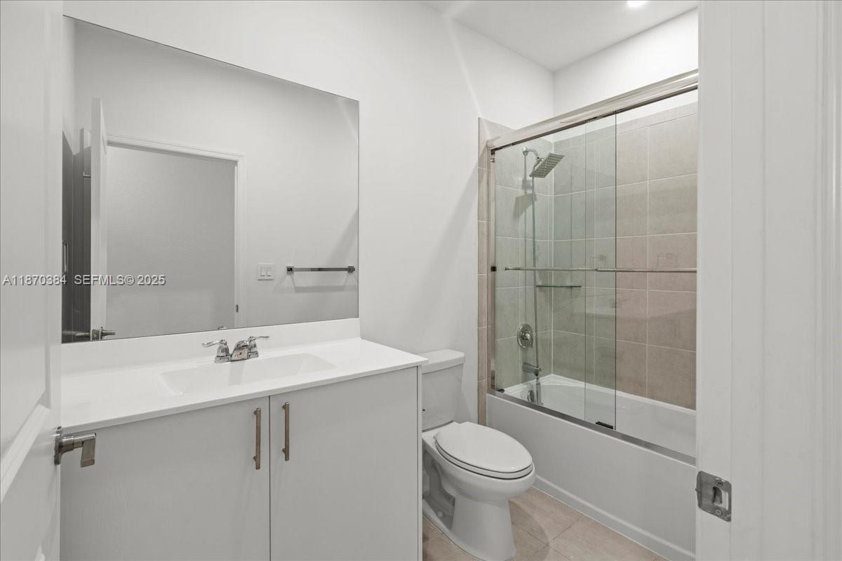 19803 Southwest 321st Street Homestead, FL 33030 - Photo 31 of 48 a bathroom with a sink a toilet and shower