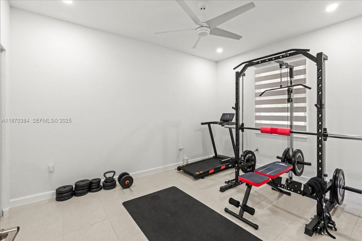 19803 Southwest 321st Street Homestead, FL 33030 - Photo 36 of 48 a view of a room with gym equipment