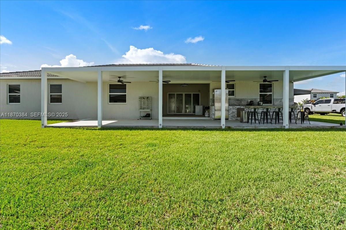 19803 Southwest 321st Street Homestead, FL 33030 - Photo 43 of 48 a view of a house with a swimming pool