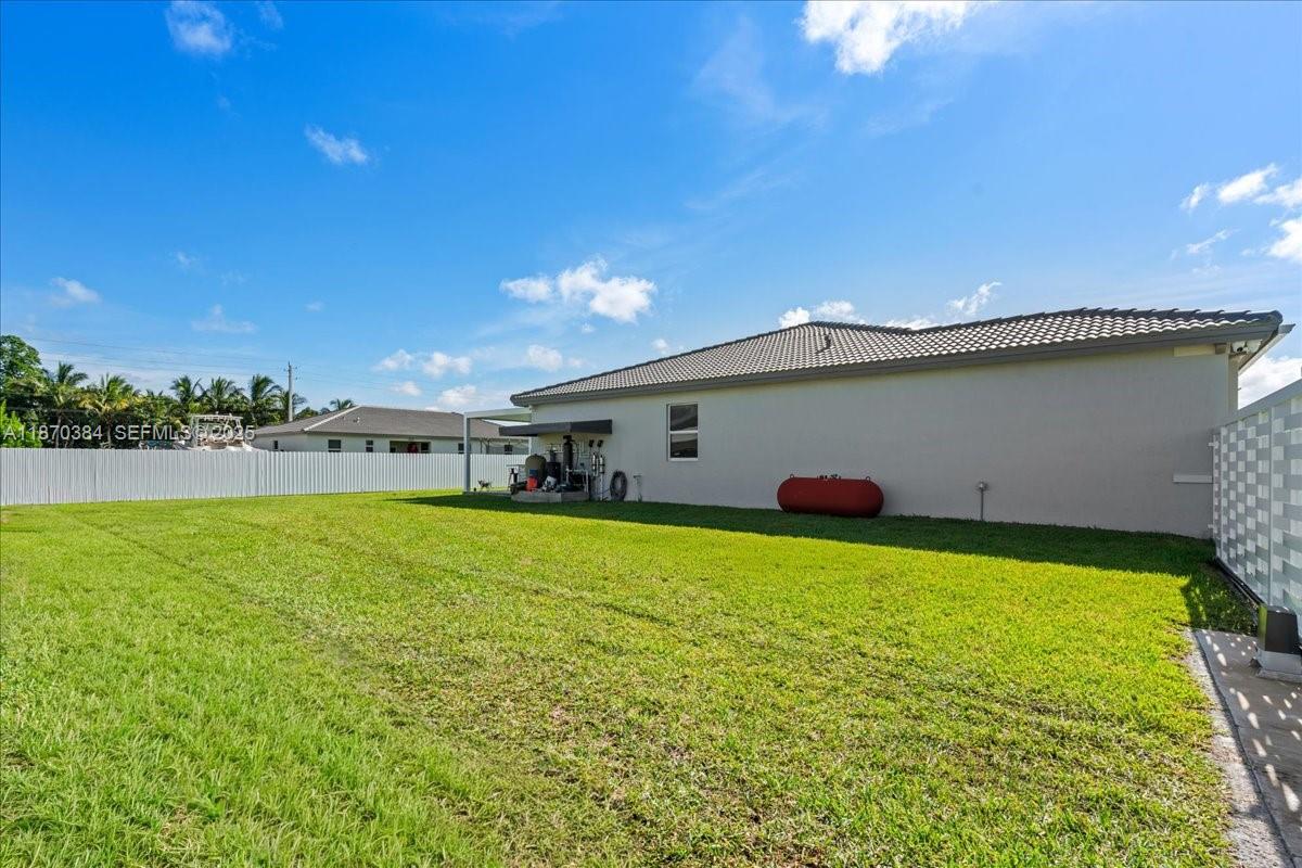 19803 Southwest 321st Street Homestead, FL 33030 - Photo 46 of 48 a view of a house with backyard