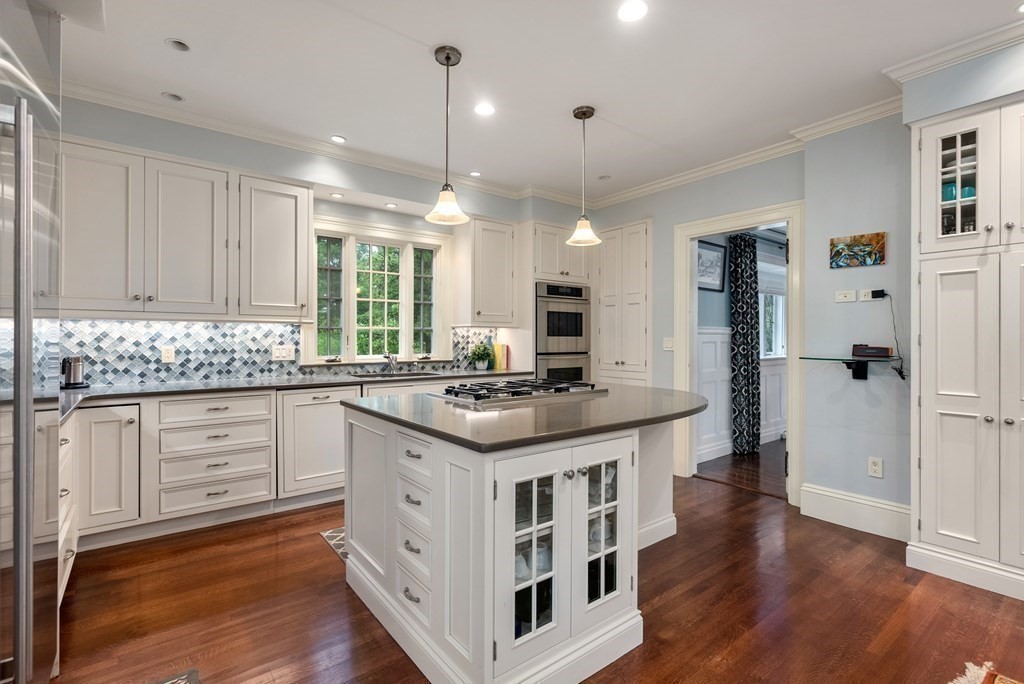 19 Burnham Road Newton, MA 02465 - Photo 12 of 30 a kitchen with stainless steel appliances granite countertop a stove and a refrigerator