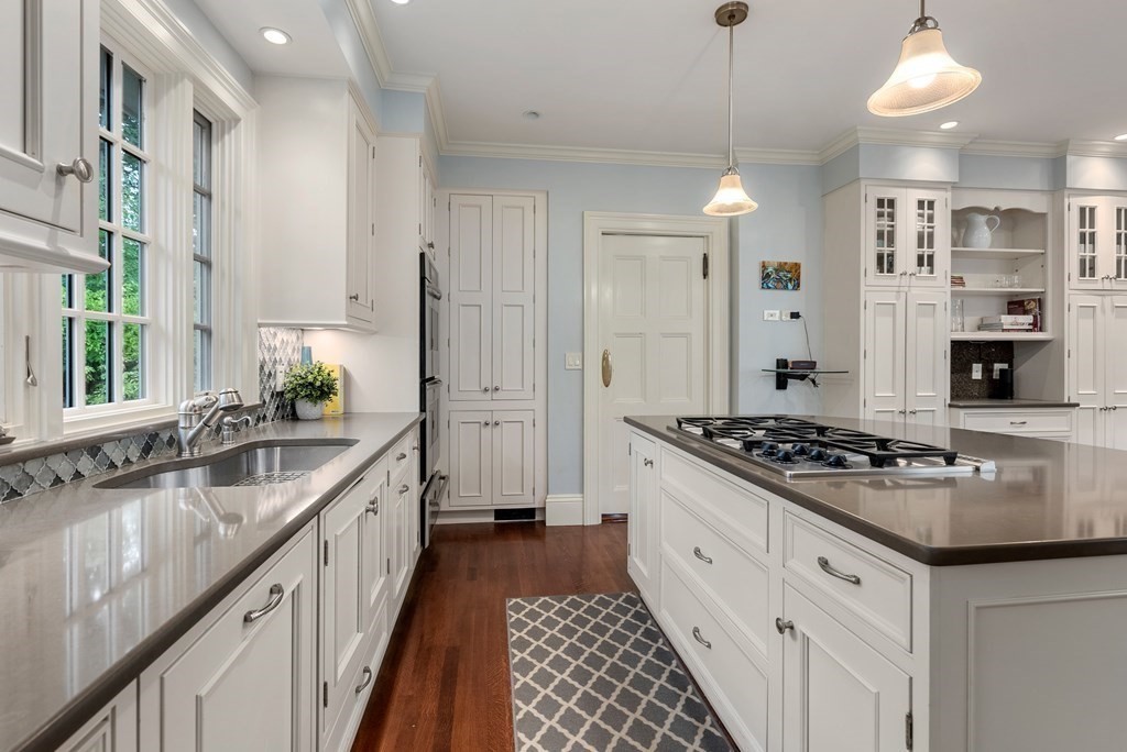 19 Burnham Road Newton, MA 02465 - Photo 13 of 30 a kitchen with stainless steel appliances granite countertop a stove and a sink