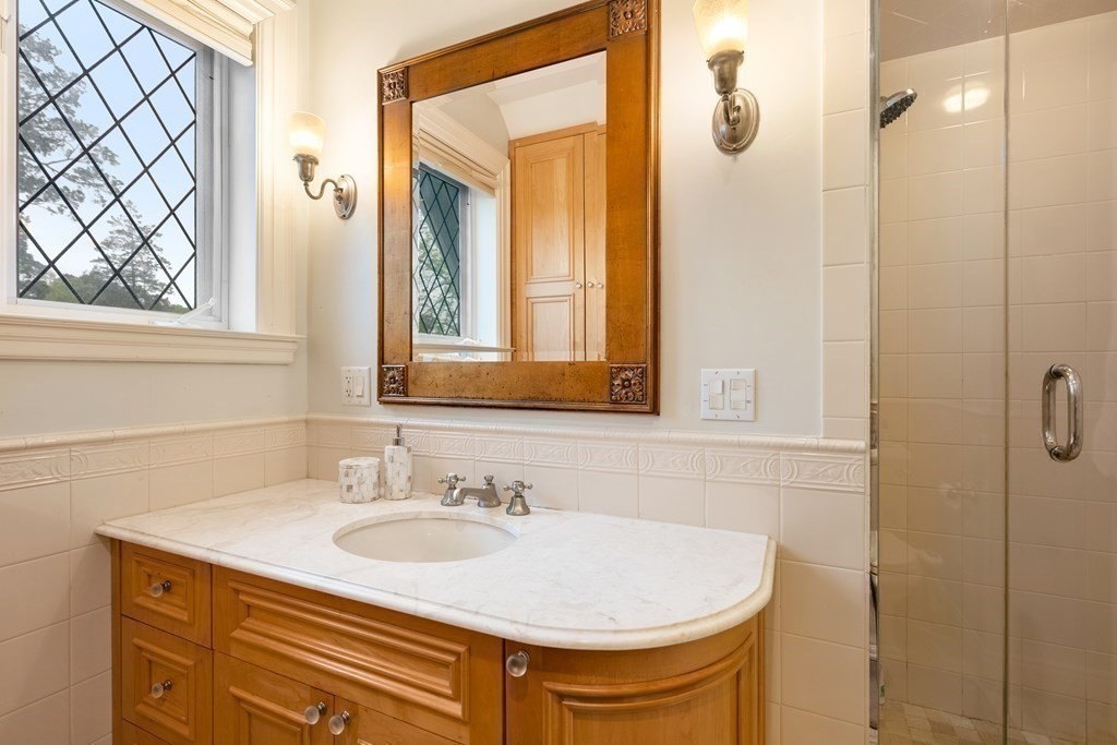 19 Burnham Road Newton, MA 02465 - Photo 19 of 30 a bathroom with a sink and a mirror
