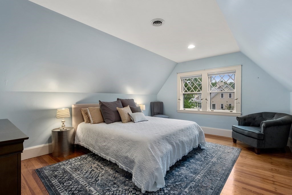 19 Burnham Road Newton, MA 02465 - Photo 23 of 30 a bedroom with a large bed and a couch