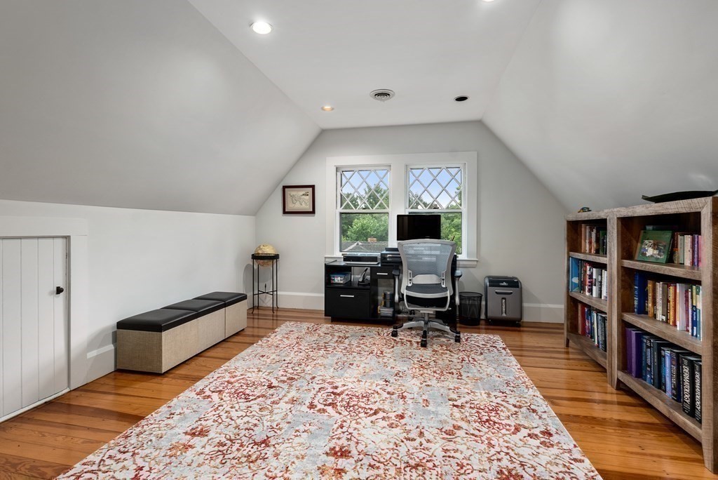 19 Burnham Road Newton, MA 02465 - Photo 24 of 30 a living room with furniture and a book shelf