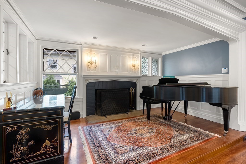 19 Burnham Road Newton, MA 02465 - Photo 7 of 30 a living room with furniture and a fireplace