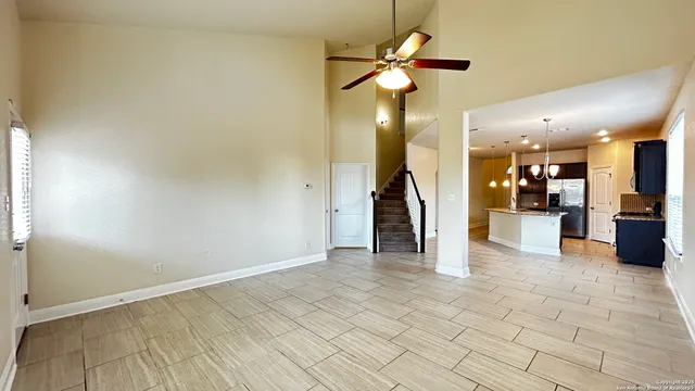 a view of a livingroom with a kitchen