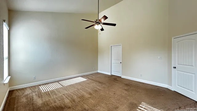 a view of a room with a hanging light