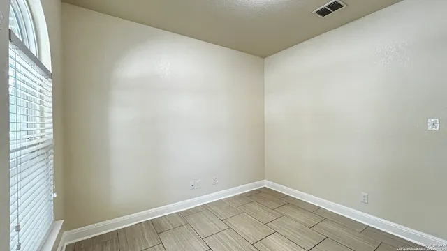a view of an empty room and window