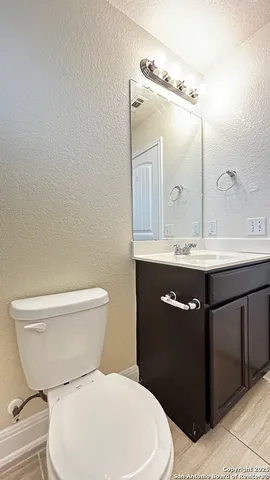 a bathroom with a toilet and a bathtub