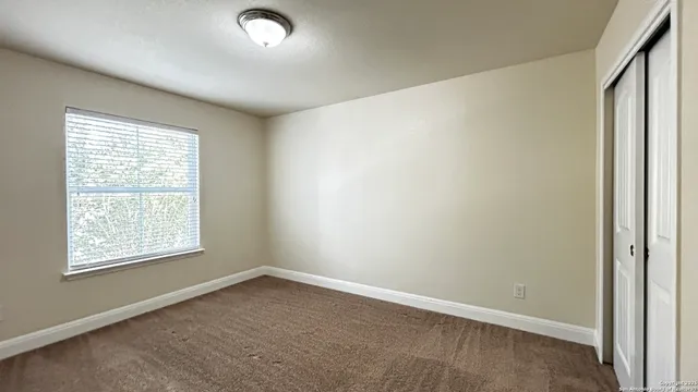 an empty room with wooden floor