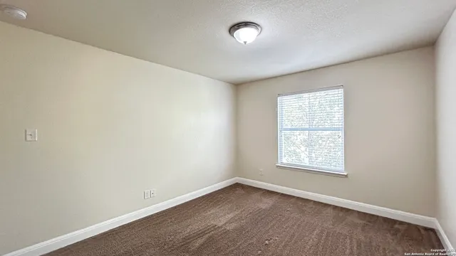 a view of a street view from a balcony