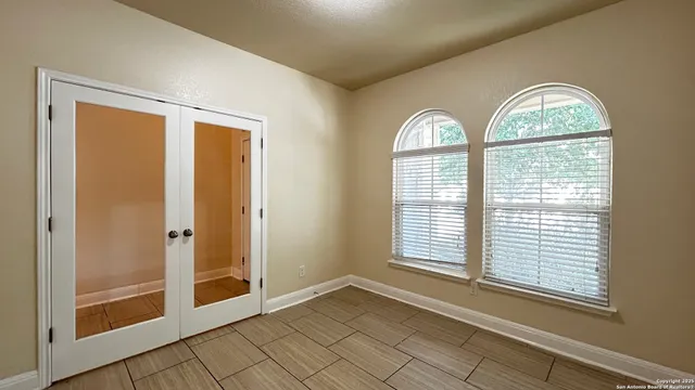 a view of an empty room with a window