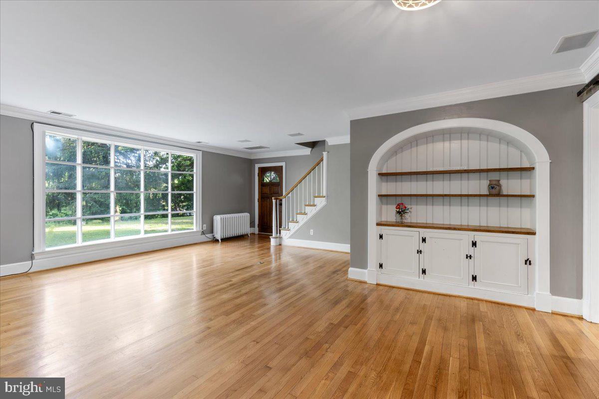 1100 Plum Point Road Huntingtown, MD 20639 - Photo 6 of 52 LIVING ROOM W/BUILT IN CABINET