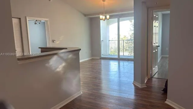 a view of a livingroom with wooden floor