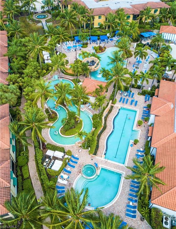 975 Sandpiper Street, Unit A104 Naples, FL 34102 - Photo 20 of 33 a view of a table with chairs