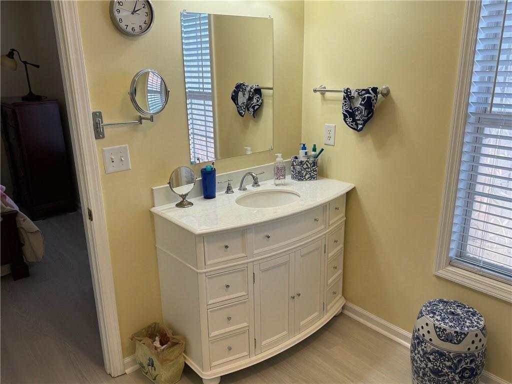 150 Old Mill Road, Unit 406 Cartersville, GA 30120 - Photo 15 of 34 a bathroom with a sink and a mirror