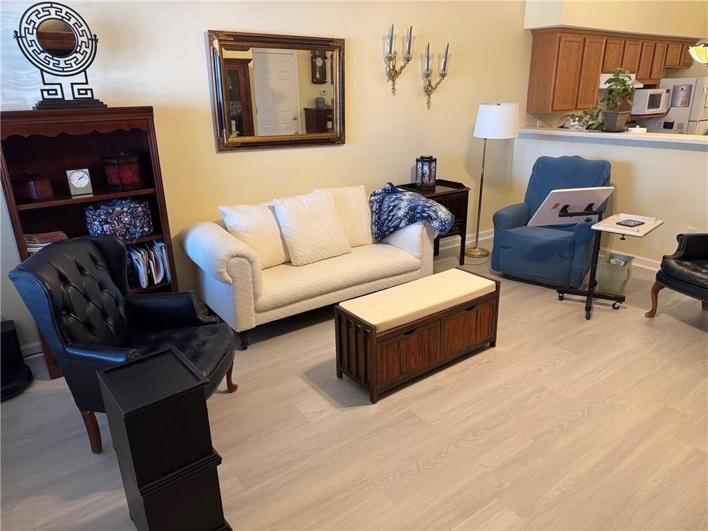 150 Old Mill Road, Unit 406 Cartersville, GA 30120 - Photo 10 of 34 a living room with furniture and a lamp