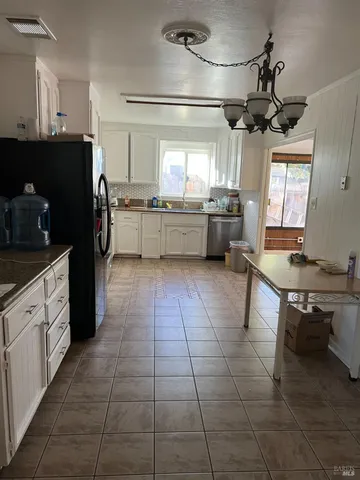 a kitchen with a counter space a sink and appliances
