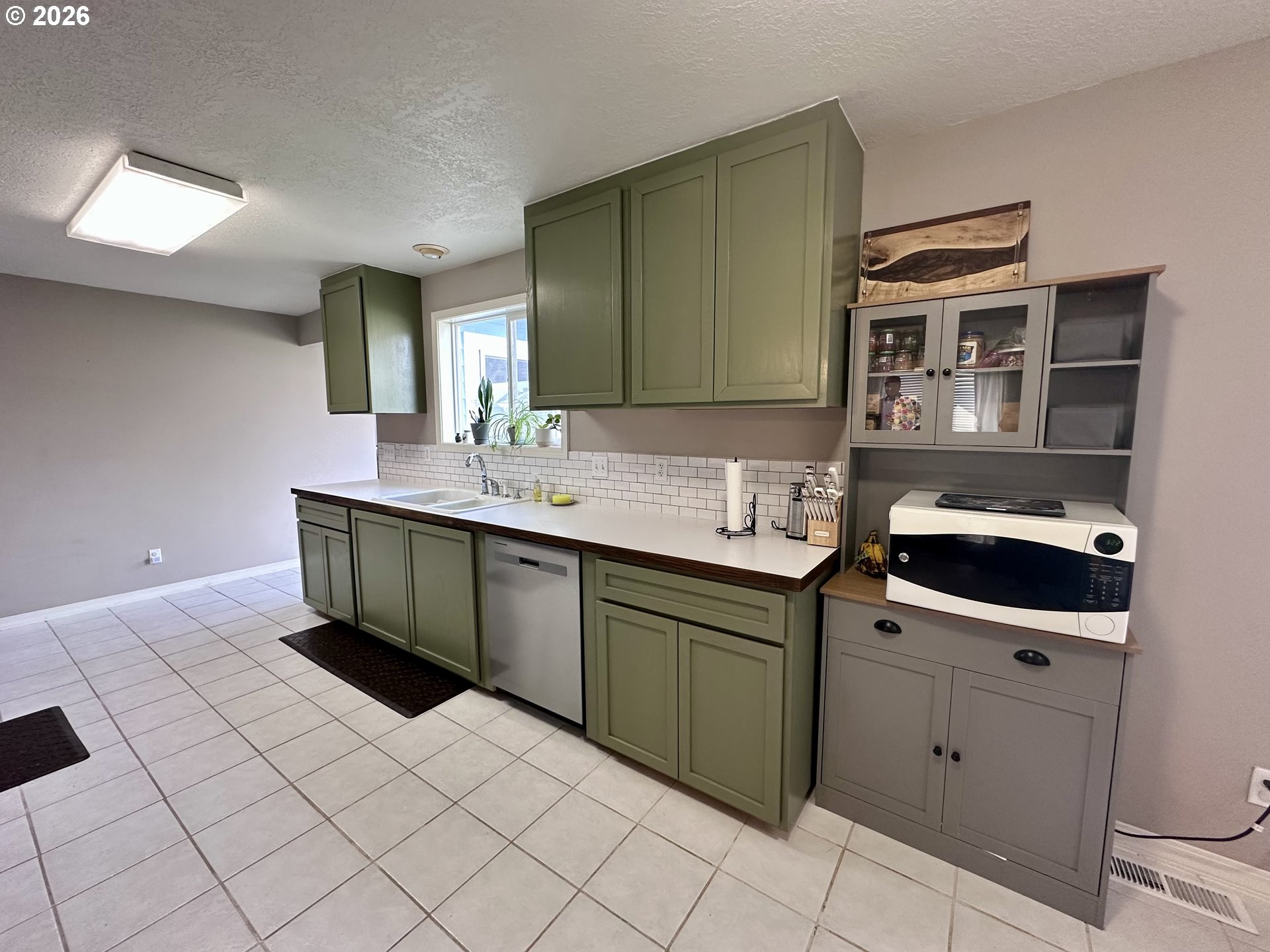 169 West Chestnut Street Union, OR 97883 - Photo 11 of 35 a kitchen with a sink and cabinets