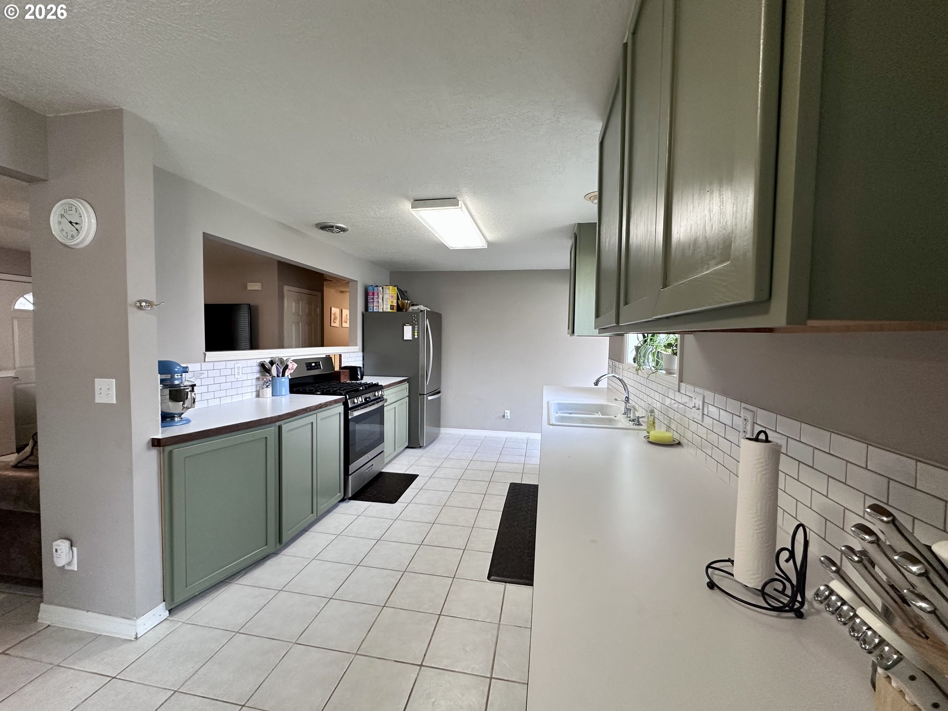 169 West Chestnut Street Union, OR 97883 - Photo 12 of 35 a kitchen with granite countertop stainless steel appliances and a sink