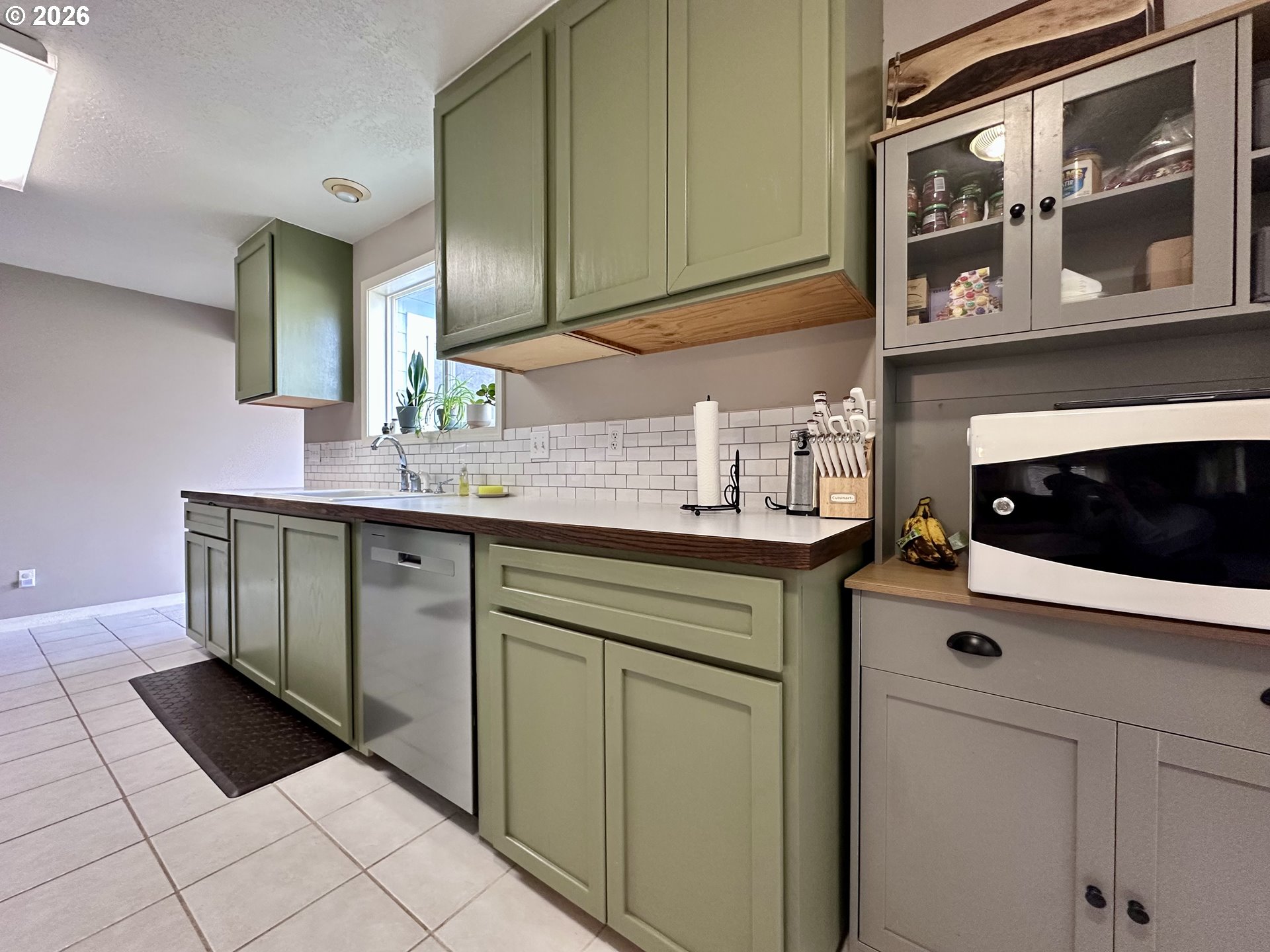169 West Chestnut Street Union, OR 97883 - Photo 14 of 35 a kitchen with stainless steel appliances a sink stove and cabinets