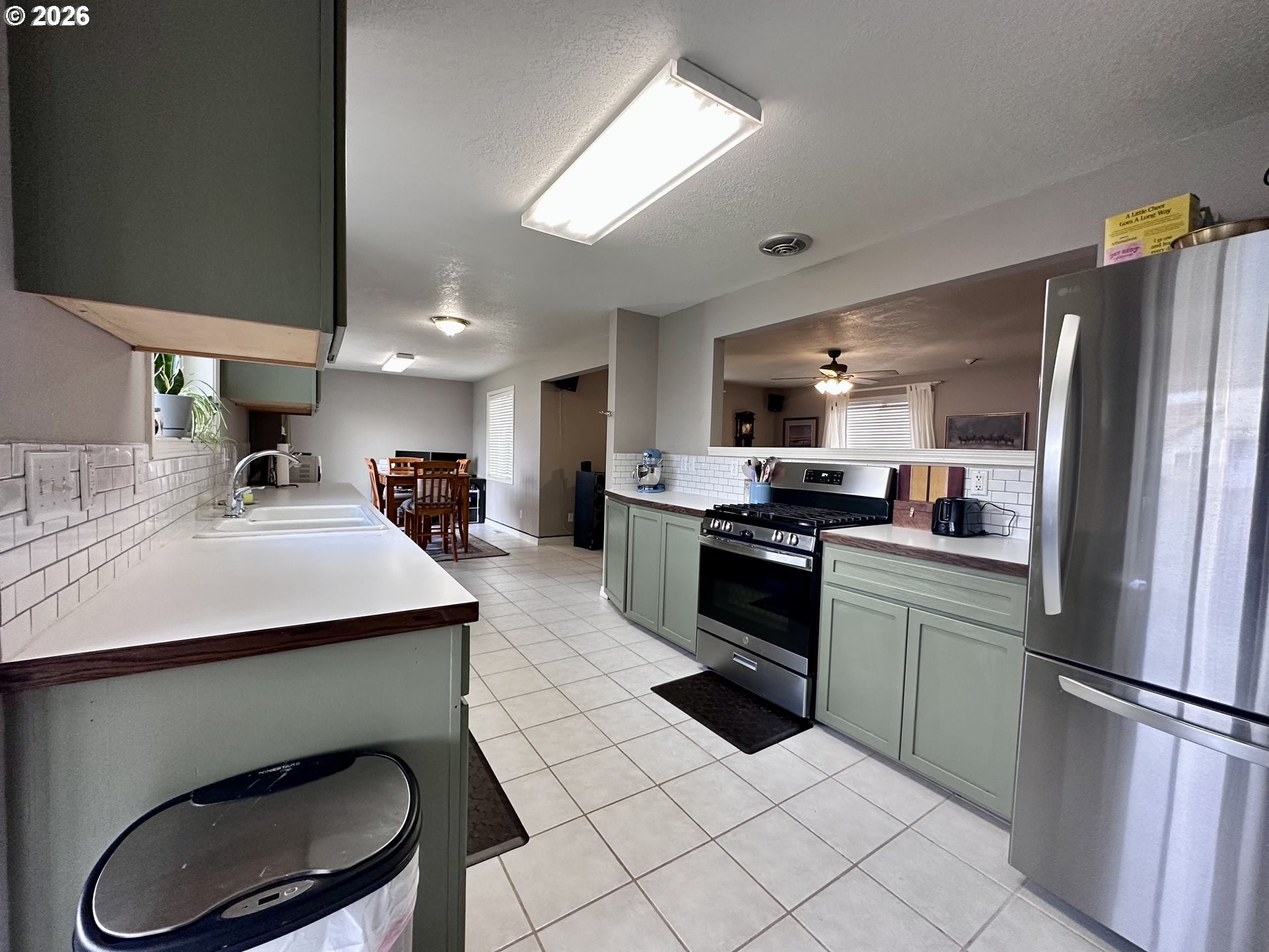 169 West Chestnut Street Union, OR 97883 - Photo 17 of 35 a kitchen with stainless steel appliances a sink a stove a refrigerator and cabinets