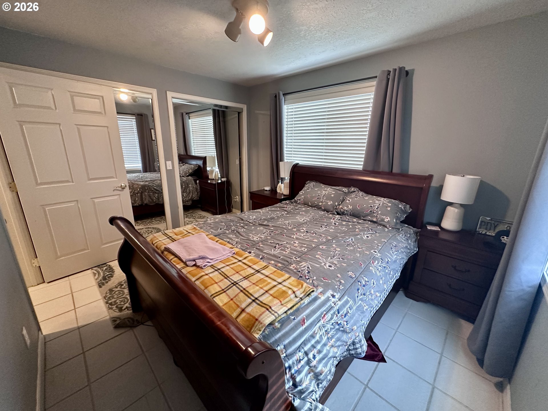 169 West Chestnut Street Union, OR 97883 - Photo 19 of 35 a bed sitting in a bedroom next to a window