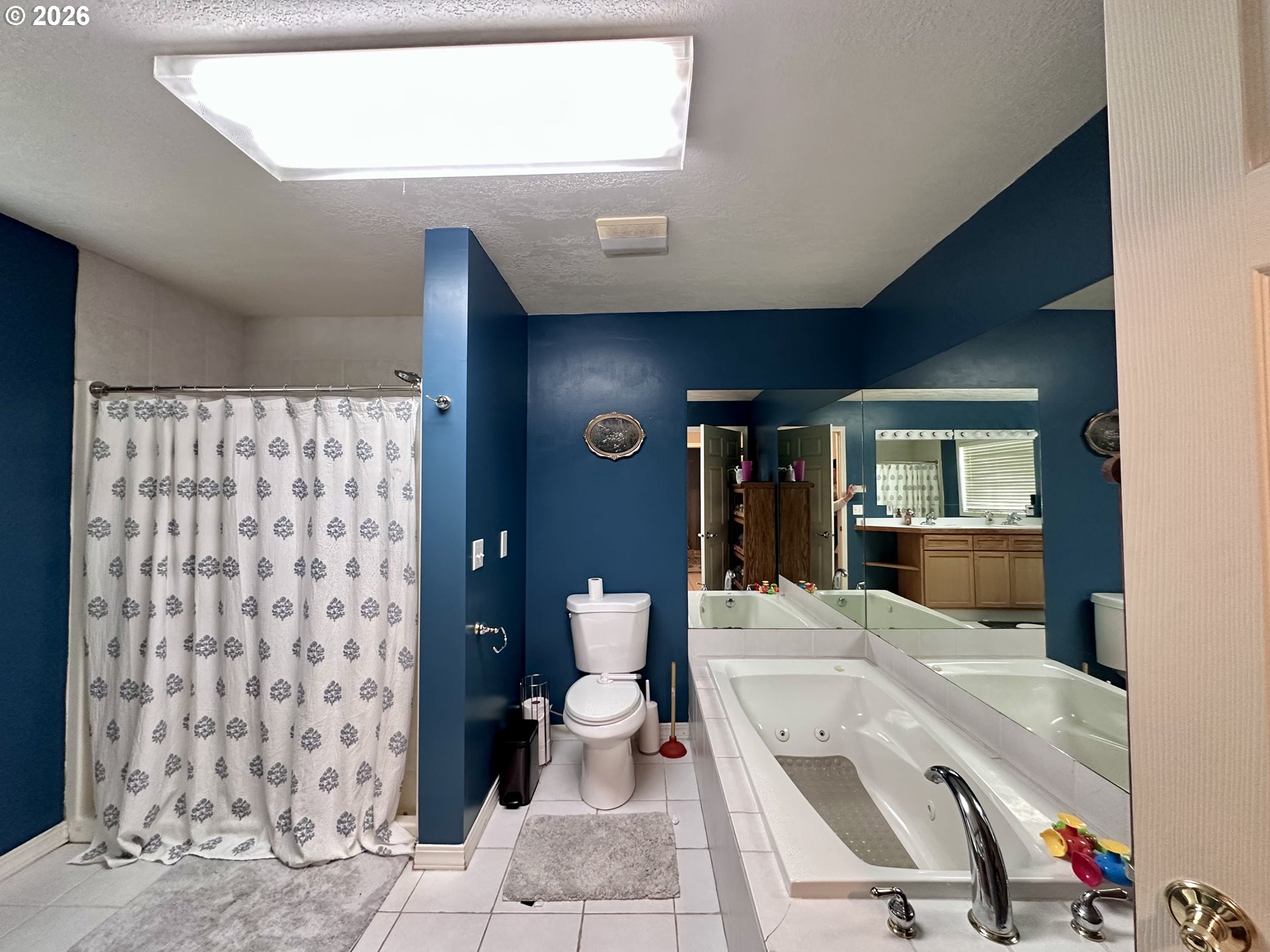 169 West Chestnut Street Union, OR 97883 - Photo 26 of 35 a living room with a couch and a walk in closet with wooden floor