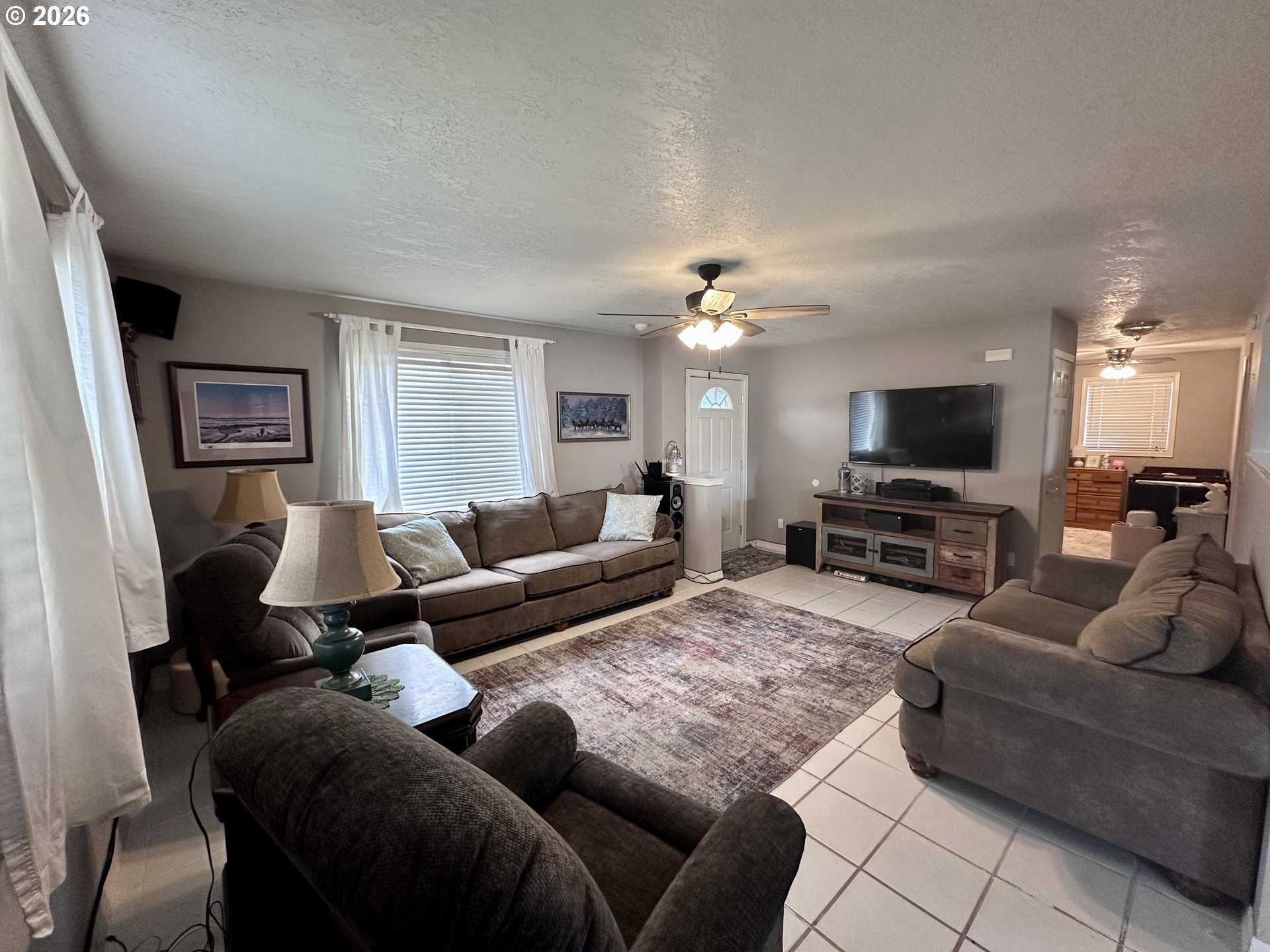 169 West Chestnut Street Union, OR 97883 - Photo 8 of 35 a living room with furniture and a flat screen tv