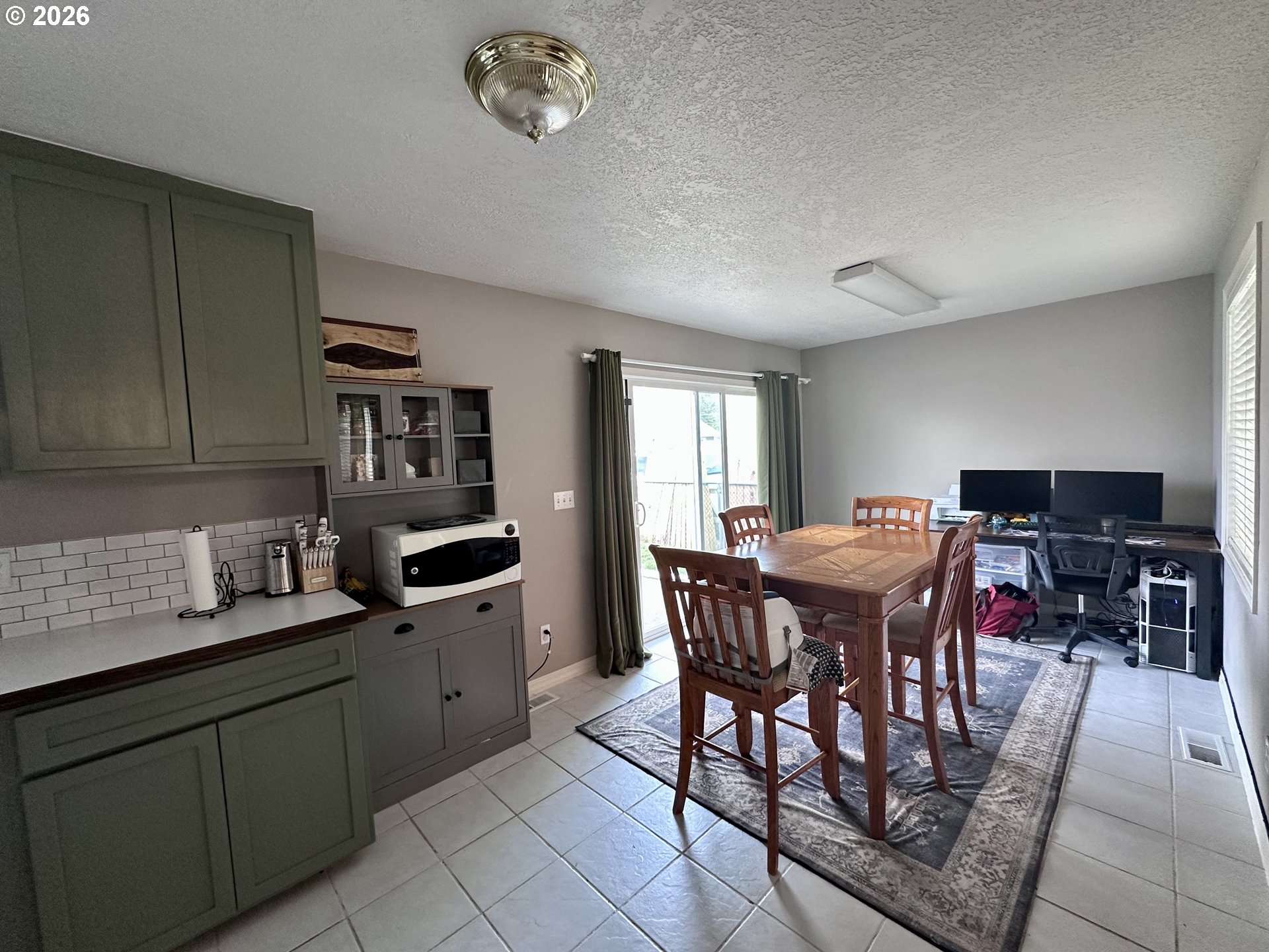 169 West Chestnut Street Union, OR 97883 - Photo 9 of 35 a open kitchen with stainless steel appliances granite countertop a sink a stove a dining table and chairs