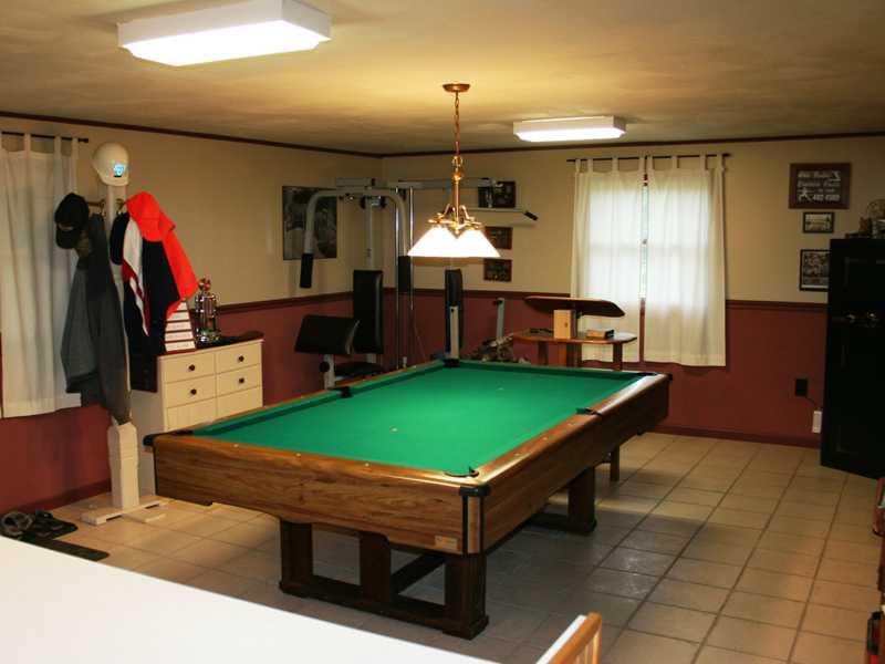 267 Isle Road Butler, PA 16001 - Photo 9 of 13 Other. Bonus room is walkout, on lower level, and large enough for a pool table or exercise equipment, office, workshop etc. White object in front is a removable bar. Water is present behind bar (kitchenette possible)