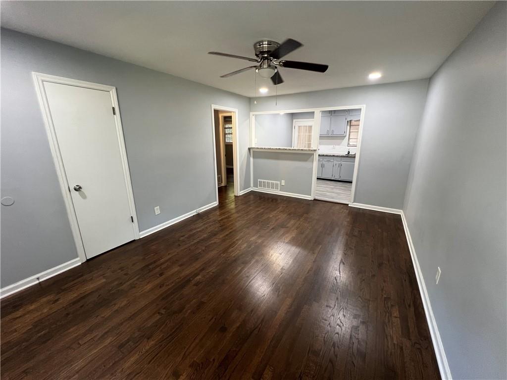 1083 Center Street Southwest, Unit A Mableton, GA 30126 - Photo 3 of 18 a view of a livingroom with wooden floor and a ceiling fan