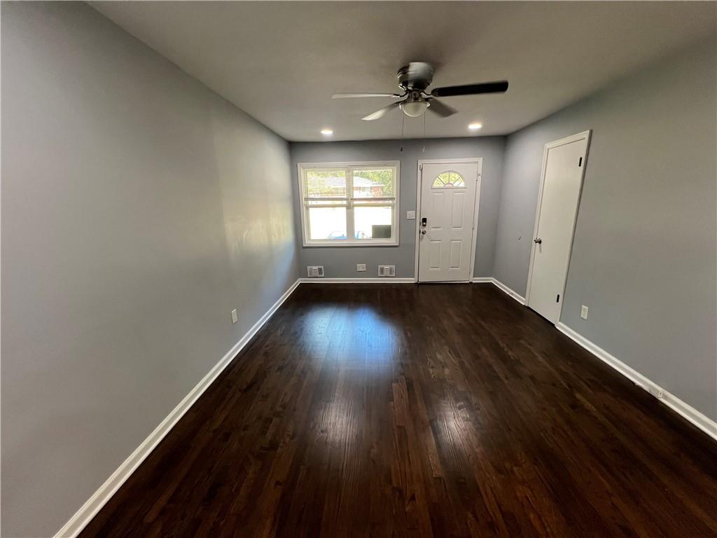 1083 Center Street Southwest, Unit A Mableton, GA 30126 - Photo 5 of 18 an empty room with wooden floor and windows