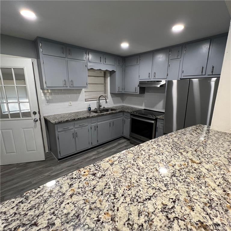 1083 Center Street Southwest, Unit A Mableton, GA 30126 - Photo 8 of 18 a kitchen with stainless steel appliances granite countertop a refrigerator sink and cabinets