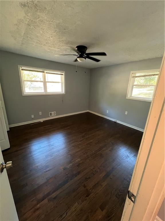 1083 Center Street Southwest, Unit A Mableton, GA 30126 - Photo 9 of 18 an empty room with wooden floor and windows