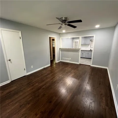 a kitchen with a stove a refrigerator and a sink