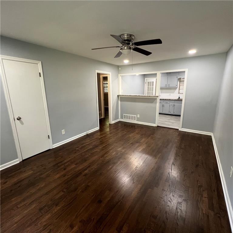 1083 Center Street Southwest, Unit A Mableton, GA 30126 - Photo 10 of 18 a view of an empty room with wooden floor and a ceiling fan