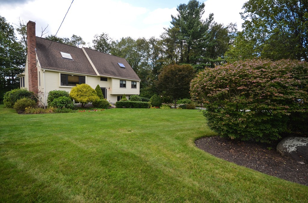 66 Dodge Hill Road Sutton, MA 01590 - Photo 1 of 29 a view of a house with garden