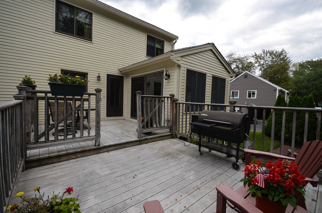66 Dodge Hill Road Sutton, MA 01590 - Photo 26 of 29 a view of a house with wooden deck and furniture