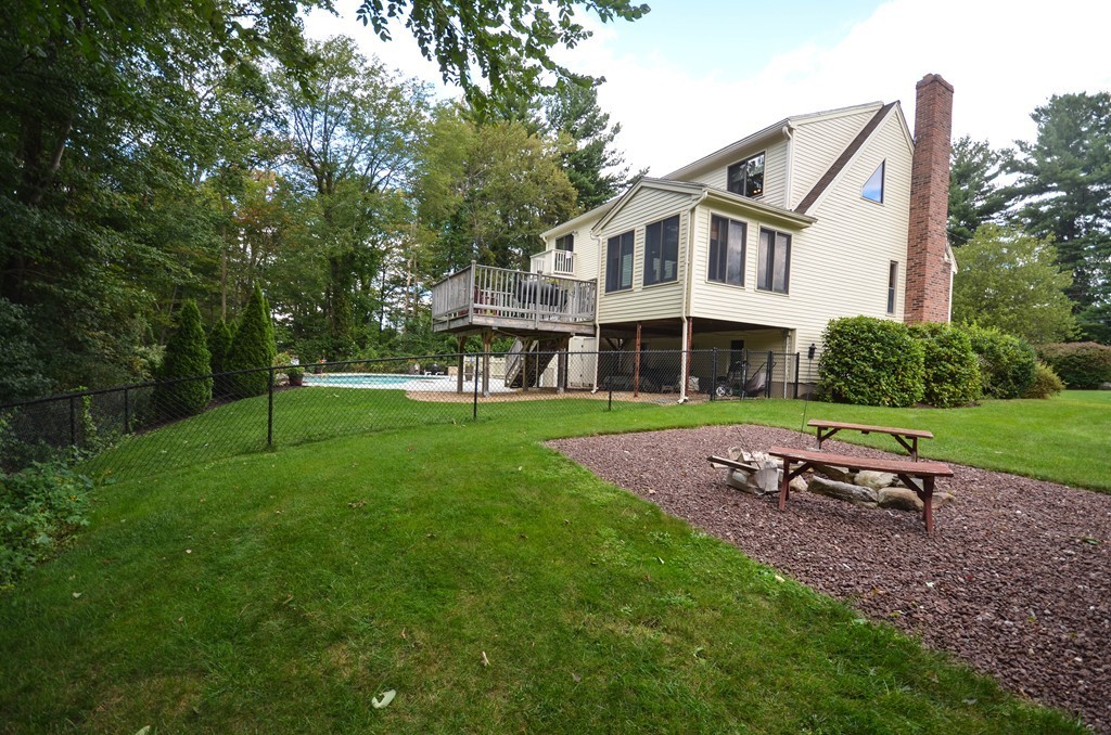 66 Dodge Hill Road Sutton, MA 01590 - Photo 29 of 29 a front view of a house with a yard table and chairs