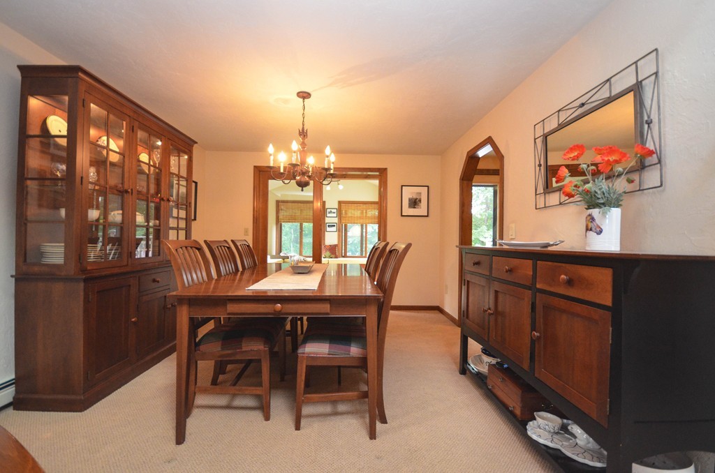 66 Dodge Hill Road Sutton, MA 01590 - Photo 5 of 29 a view of a dining room with furniture and chandelier