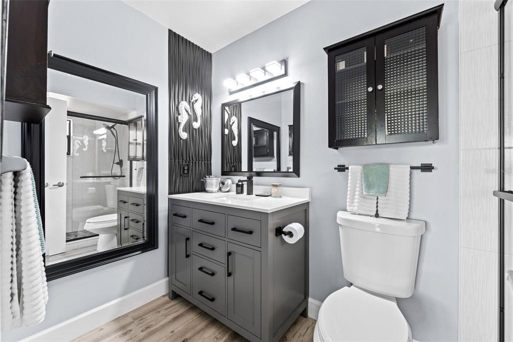 29 Pelican Lane Edgewater, FL 32141 - Photo 15 of 39 a bathroom with a toilet sink and mirror