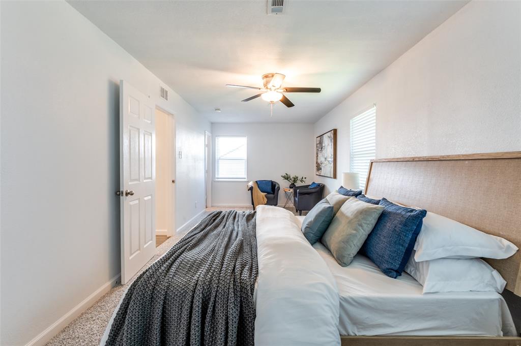 1209 Ridgeway Drive Richardson, TX 75080 - Photo 28 of 33 a bed room with a bed and a chandelier