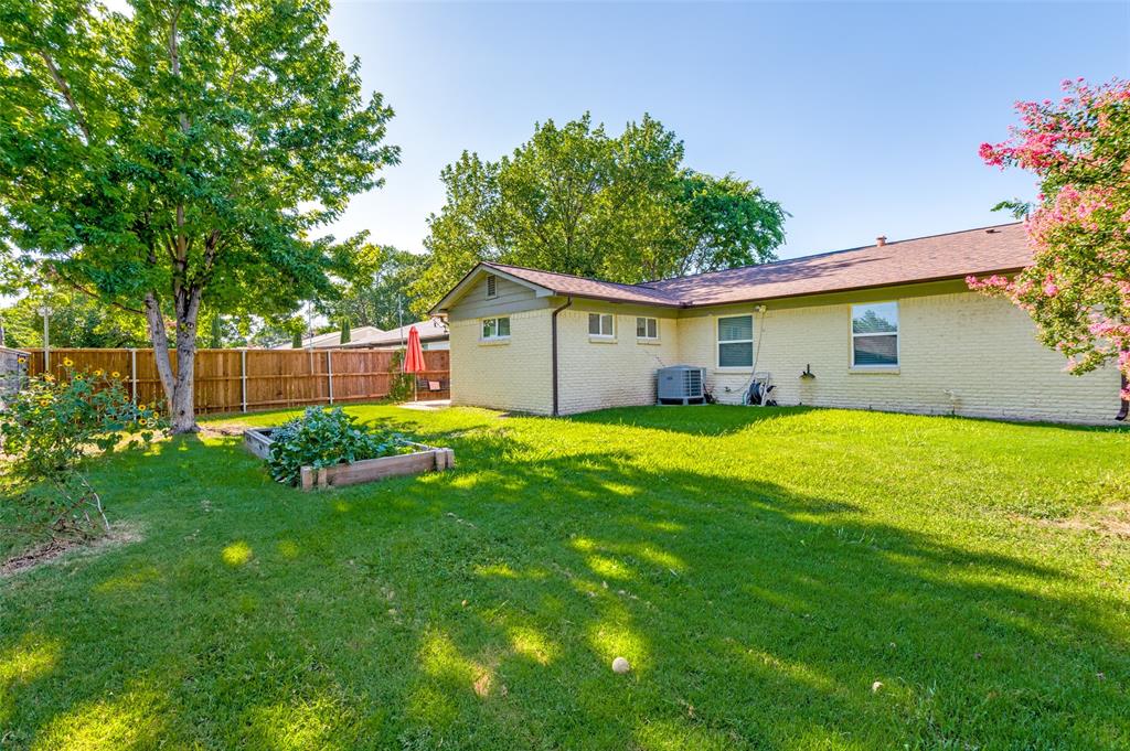 1209 Ridgeway Drive Richardson, TX 75080 - Photo 31 of 33 a house view with a garden space